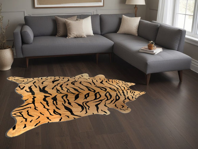 5' X 7' Black And Orange Cowhide Area Rug