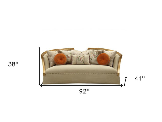 41" Beige Velvet Curved Sofa And Toss Pillows With Natural Legs