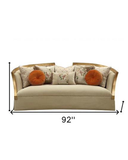 41" Beige Velvet Curved Sofa And Toss Pillows With Natural Legs
