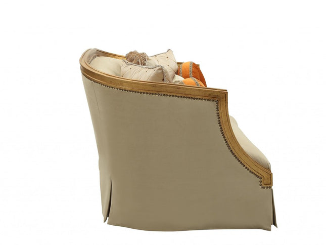 70" Tan And Gold Curved Loveseat and Toss Pillows