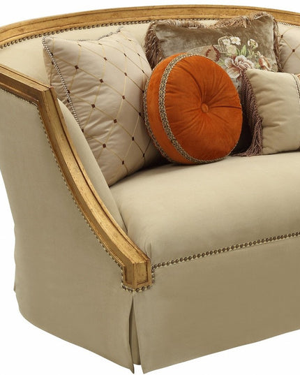 70" Tan And Gold Curved Loveseat and Toss Pillows