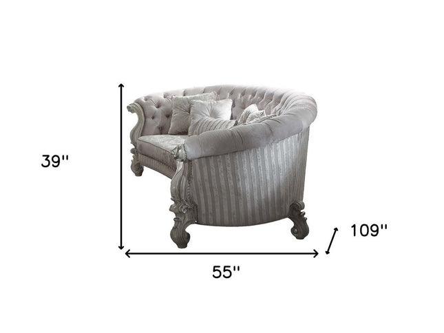 55" Ivory Velvet Curved Floral Sofa And Toss Pillows With Gray Legs