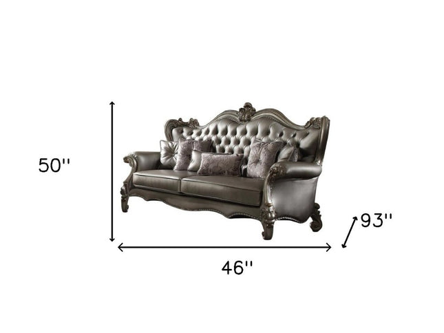 46" Platinum Faux Leather Curved Sofa And Toss Pillows