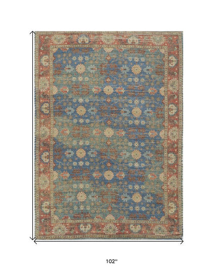 5' X 7' Blue Red And Beige Floral Medallion Hand Woven Distressed Area Rug