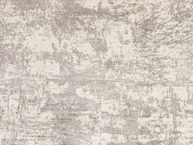 8' X 11' Beige And Ivory Abstract Hand Loomed Area Rug