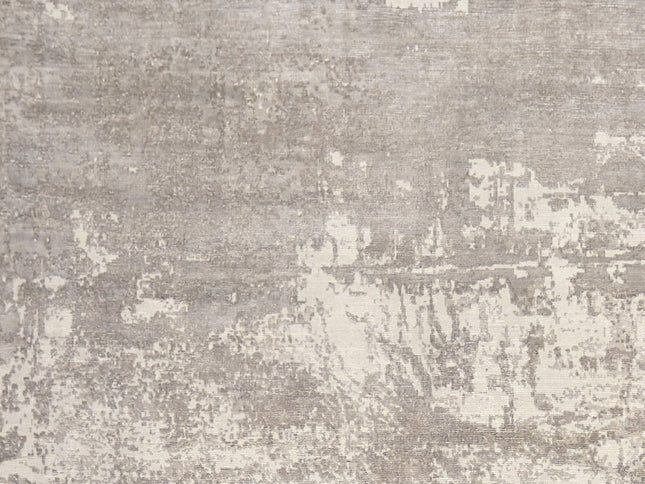 8' X 11' Beige And Ivory Abstract Hand Loomed Area Rug