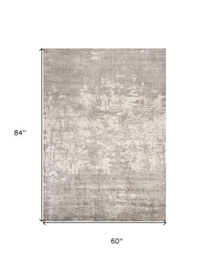 8' X 11' Beige And Ivory Abstract Hand Loomed Area Rug