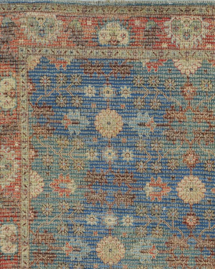 5' X 7' Blue Red And Beige Floral Medallion Hand Woven Distressed Area Rug