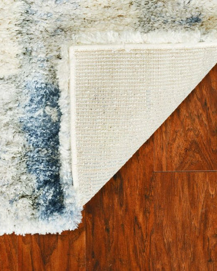 5' X 8' Ivory And Blue Abstract Area Rug