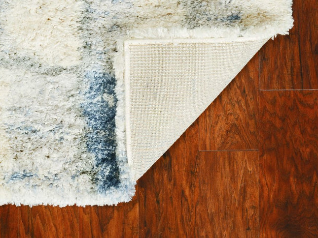 5' X 8' Ivory And Blue Abstract Area Rug