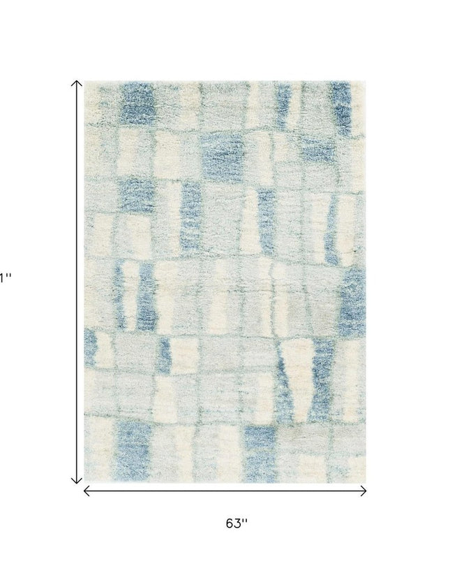 5' X 8' Ivory And Blue Abstract Area Rug