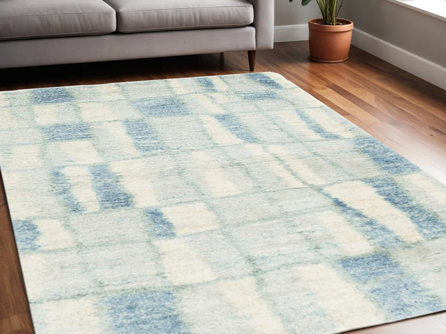 5' X 8' Ivory And Blue Abstract Area Rug