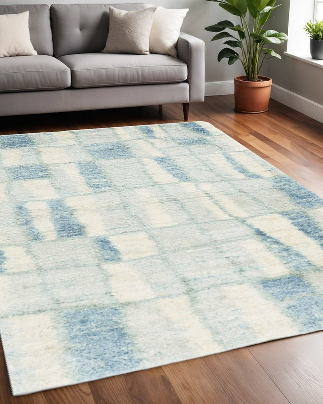 5' X 8' Ivory And Blue Abstract Area Rug