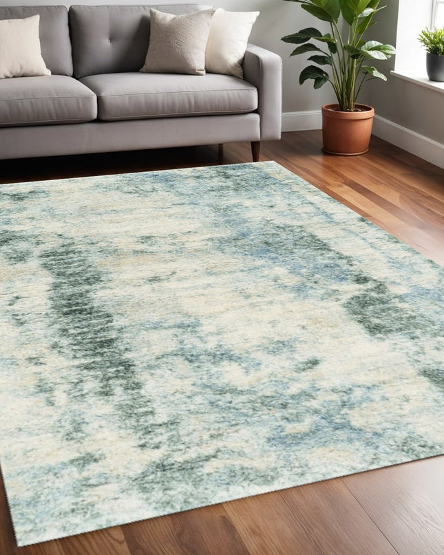 5' X 8' Ivory And Blue Abstract Area Rug