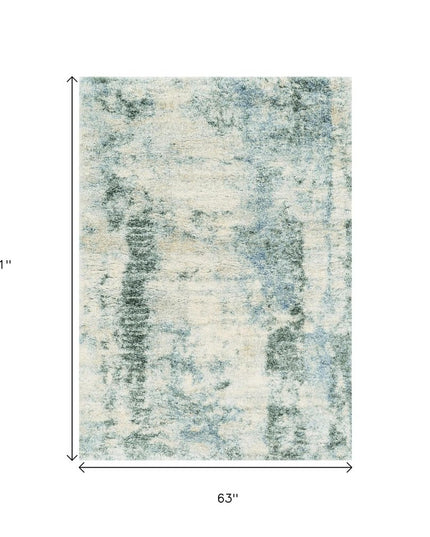 5' X 8' Ivory And Blue Abstract Area Rug