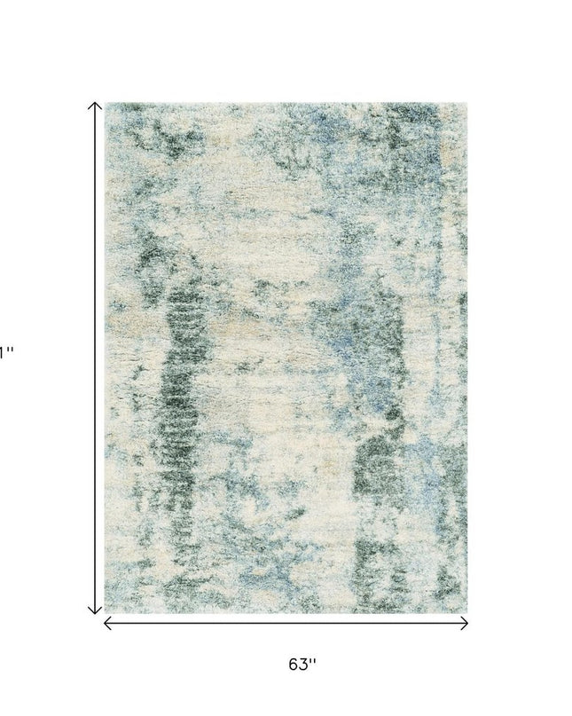 5' X 8' Ivory And Blue Abstract Area Rug