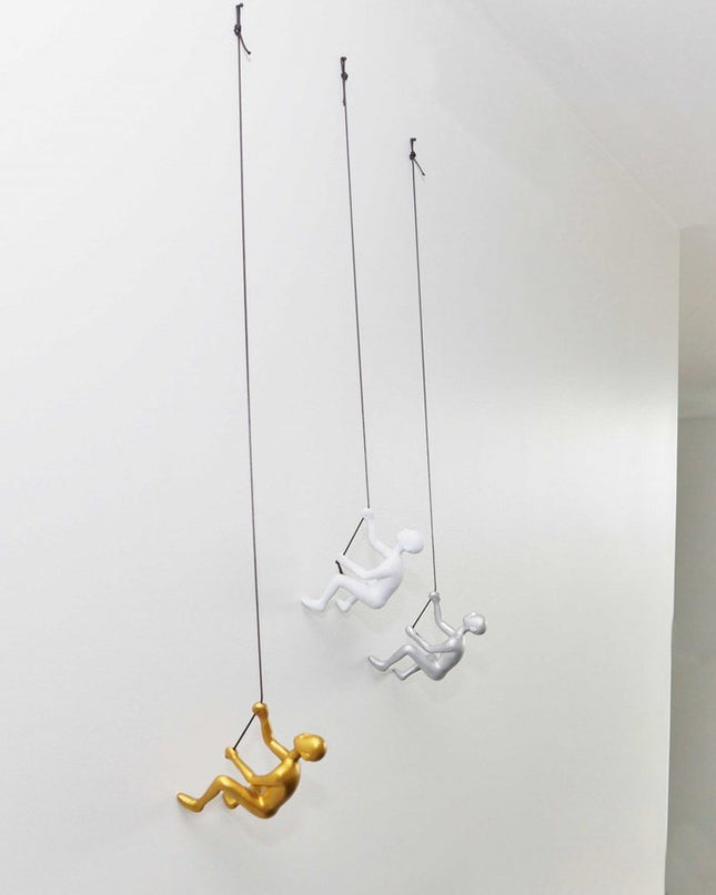 Set of Three Gold Silver And White Resin Climbing Man Hanging Dimensional Sculpture