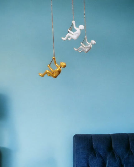 Set of Three Gold Silver And White Resin Climbing Man Hanging Dimensional Sculpture