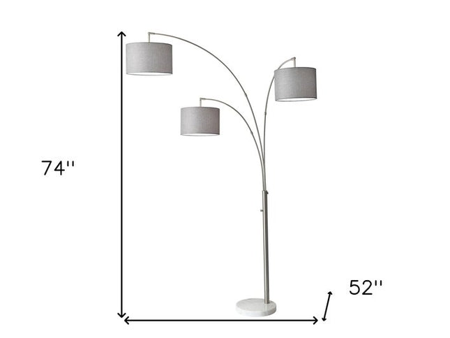 74" Brass Three Light Arc Floor Lamp With Off White Fabric Drum Shade