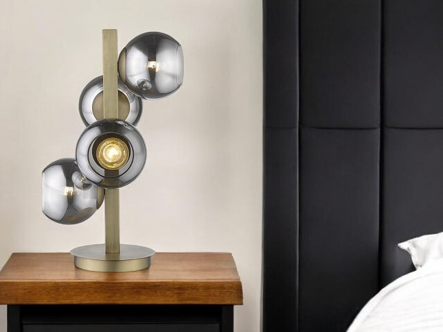 24" Brass Metal Four Light Novelty Table Lamp With Silver Metallic Globe Shades