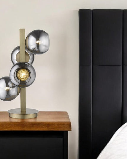 24" Brass Metal Four Light Novelty Table Lamp With Silver Metallic Globe Shades