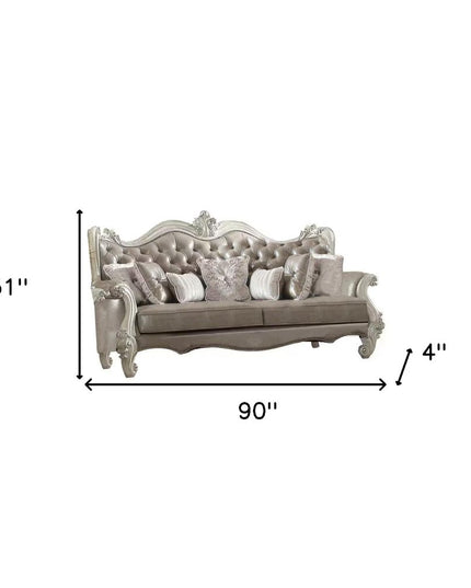 90" Gray Faux Leather Curved Sofa And Toss Pillows With Bone Legs