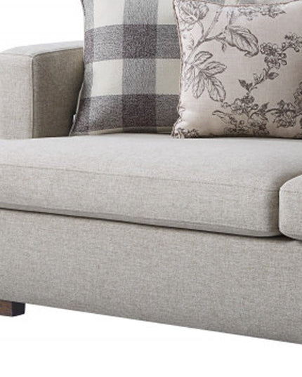 92" Beige Fabric Sofa And Toss Pillows With Brown Legs
