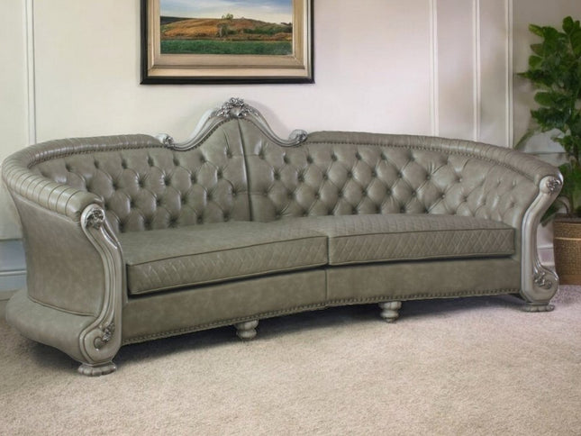 113" Bone Faux Leather Sofa And Toss Pillows With White Legs