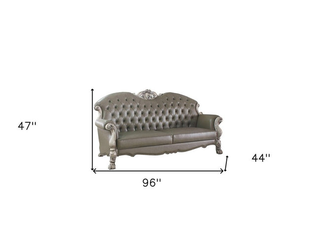 96" Bone Faux Leather Sofa And Toss Pillows With White Legs