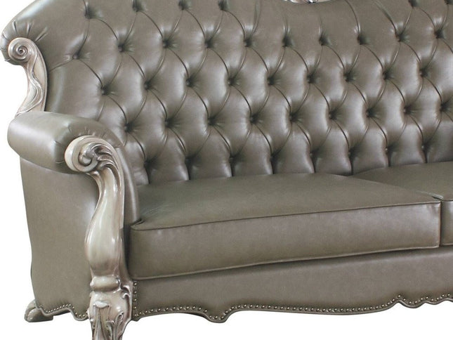 96" Bone Faux Leather Sofa And Toss Pillows With White Legs