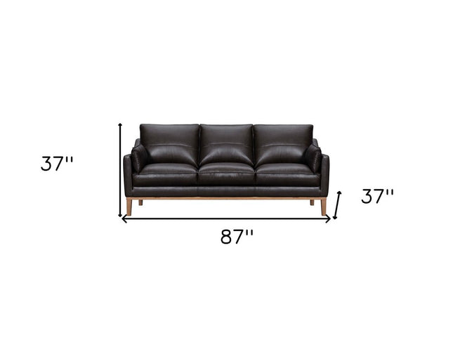 87" Dark Brown Leather Sofa And Toss Pillows With Brown Legs