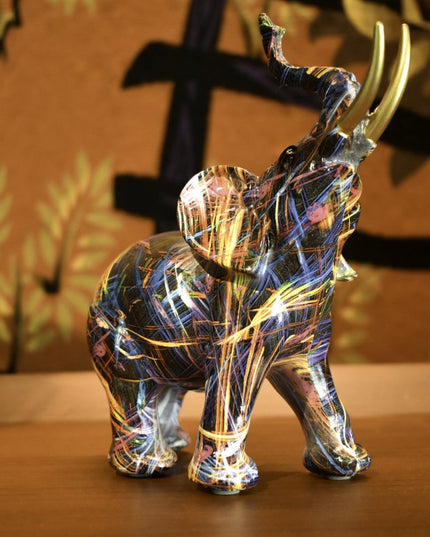 7" Blue Yellow And Pink Resin Elephant Tabletop Sculpture