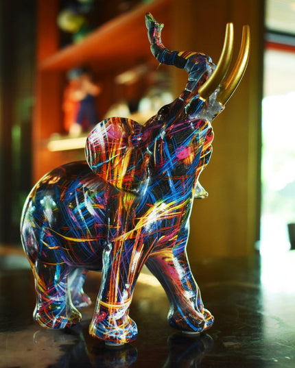 7" Blue Yellow And Pink Resin Elephant Tabletop Sculpture