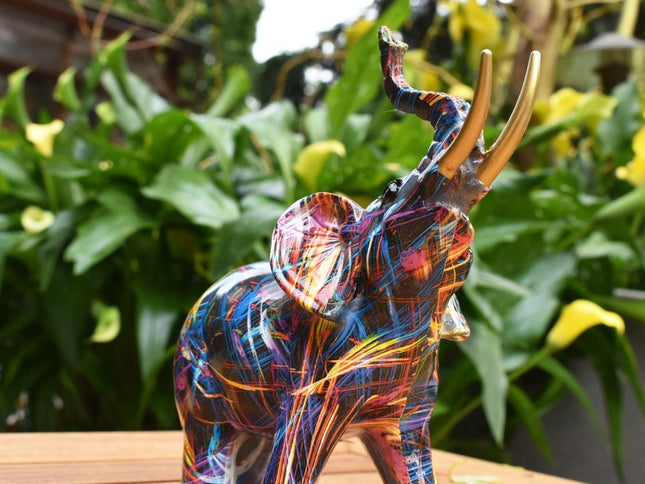 7" Blue Yellow And Pink Resin Elephant Tabletop Sculpture