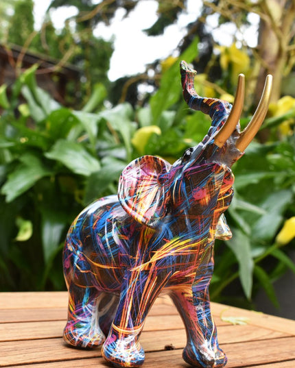 7" Blue Yellow And Pink Resin Elephant Tabletop Sculpture