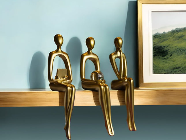 Set of Three Gold Resin People Tabletop Sculpture
