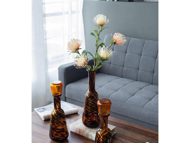 Set of Three Amber Abstract Swirl Glass Decorative Bottles With Stoppers