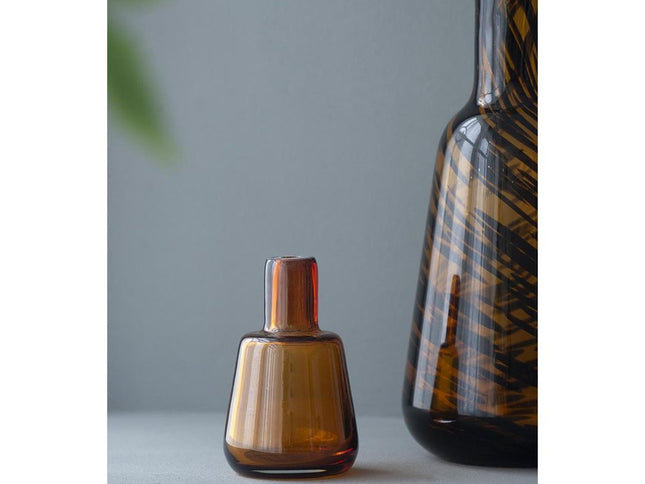 Set of Three Amber Abstract Swirl Glass Decorative Bottles With Stoppers