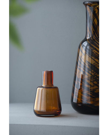 Set of Three Amber Abstract Swirl Glass Decorative Bottles With Stoppers