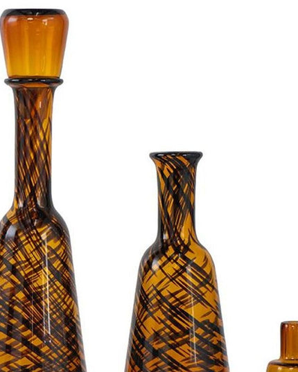 Set of Three Amber Abstract Swirl Glass Decorative Bottles With Stoppers