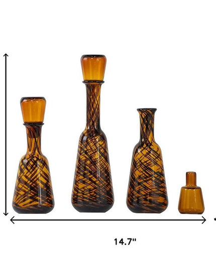 Set of Three Amber Abstract Swirl Glass Decorative Bottles With Stoppers