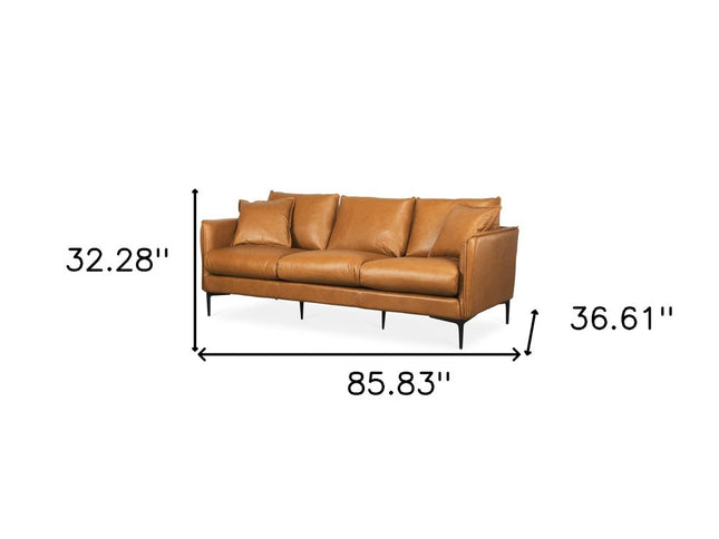 86" Tan Leather Sofa And Toss Pillows With Black Legs