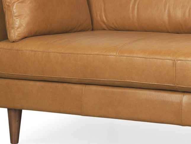 88" Tan Leather Sofa And Toss Pillows With Brown Legs