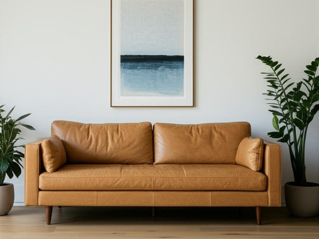 88" Tan Leather Sofa And Toss Pillows With Brown Legs