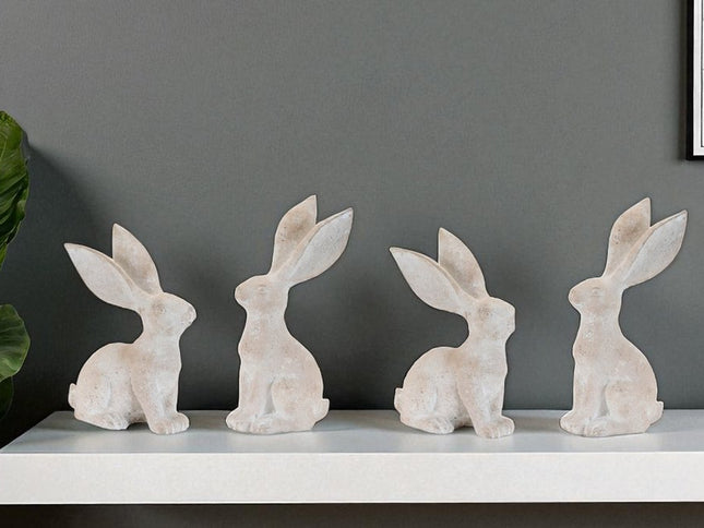 Set of Four Beige Polyresin Rabbit Figurines