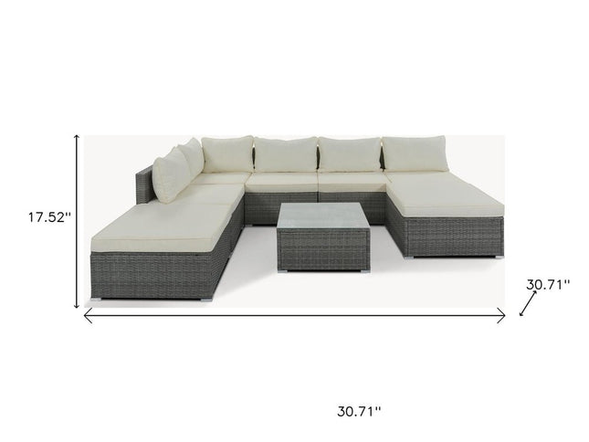Eight Piece Gray and Beige Wicker Upholstered Cushions Sectional Seating Group With Table
