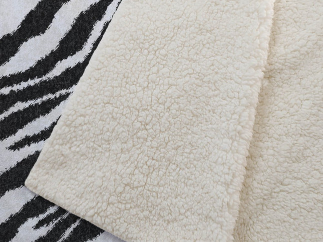 50" X 70" Black And Ivory Animal Print Polyester Woven Plush Throw Blanket