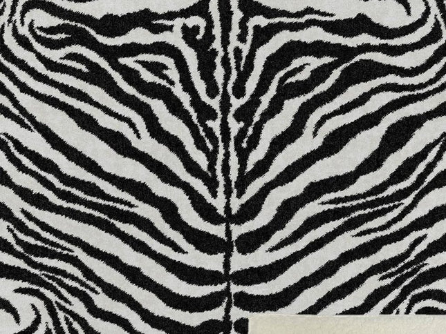 50" X 70" Black And Ivory Animal Print Polyester Woven Plush Throw Blanket