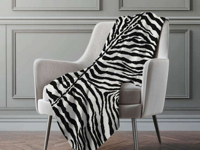 50" X 70" Black And Ivory Animal Print Polyester Woven Plush Throw Blanket