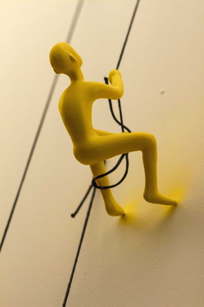 6" x 3" x 3" Resin Yellow Climbing Man